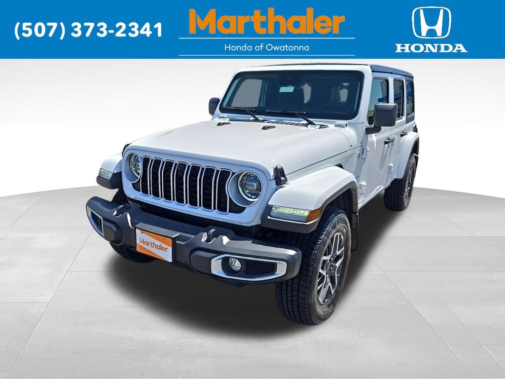 2024 Jeep Wrangler Sahara in Bright White Clearcoat — front three-quarter view
